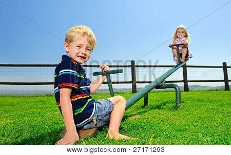 Kids Playing See-saw Image & Photo (Free Trial) | Bigstock