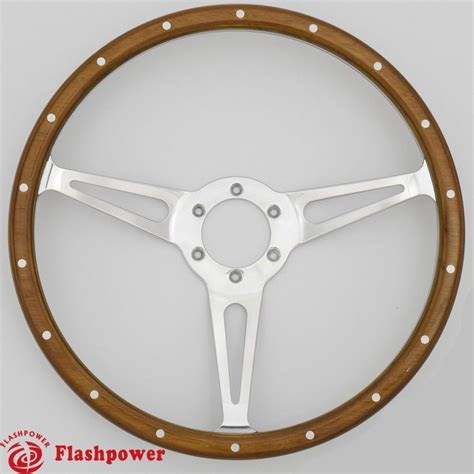 the steering wheel is made out of wood and has white spokes