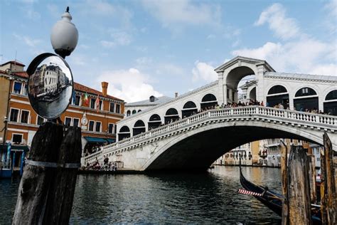 Premium Photo | Rialto bridge over canal in city