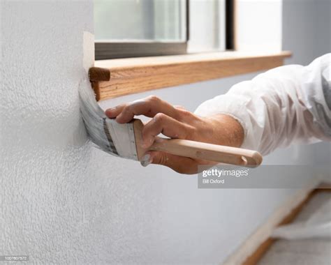 Man Painting Interior Of Home By Window High-Res Stock Photo - Getty Images