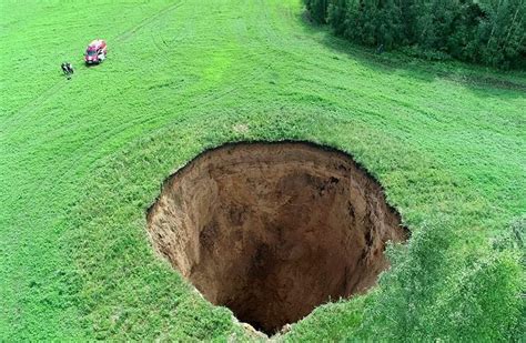 Massive 105-foot-wide Sinkhole Abruptly Appears in Russian Field ...