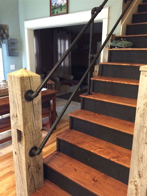 Reclaimed barn timber used as newel post w galvanized pipe handrail ...