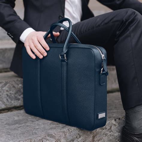 A simple way to make a serious impact. Professional and stylish, this sleek briefcase in navy ...