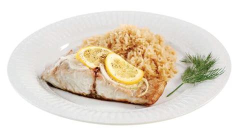 Bluefish Fillet with Garnish on White Ridged Plate - Prepared Food ...