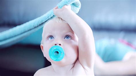 Blue Eyes Baby Toddler With Pacifier In Mouth Is Sitting In Blur Background Cute HD wallpaper ...