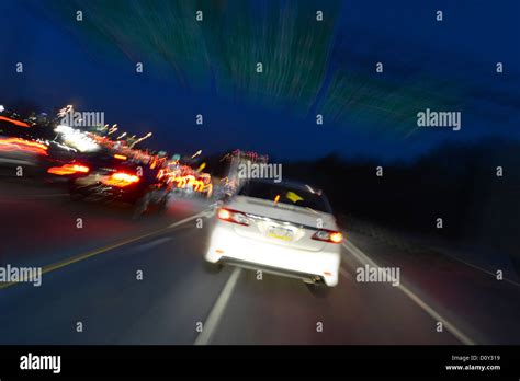 Car Speeding On Highway At Night, USA Stock Photo - Alamy