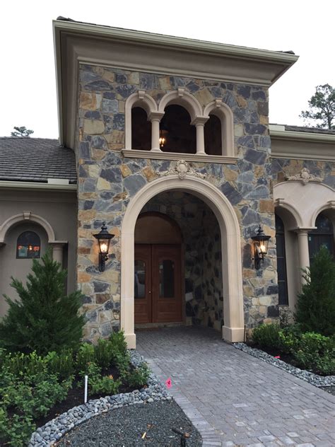 Spanish Style Home with Arched Windows and Doors