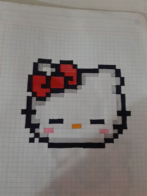 a piece of paper with an image of a hello kitty face on it, in the shape of a grid