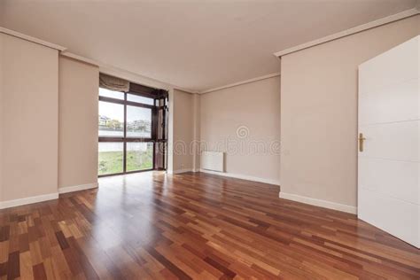 Large Empty Living Room of a House with Wooden Floors, Built-in ...