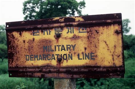 Military demarcation line sign between North and South Korea (Photo ...