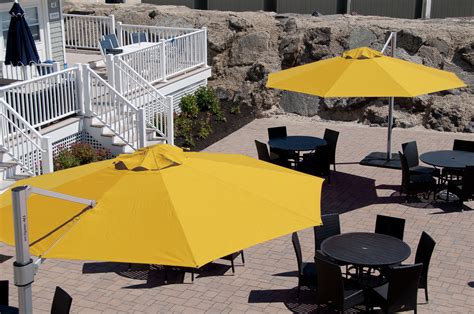 Yellow brightens up any outdoor dining area. | Umbrella, Outdoor dining area, Cantilever umbrella