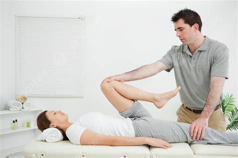 Female In A Supine Position Undergoing Stretching Exercises Photo ...