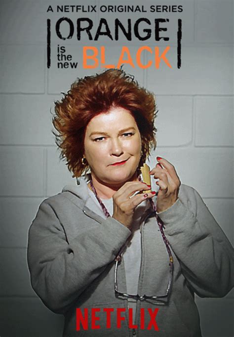 an orange is the new black poster with a woman holding a piece of food in her hands