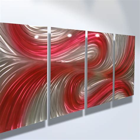 three red and white abstract paintings hanging on a wall