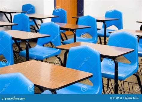 Empty desks in a classroom stock image. Image of blue - 9154941