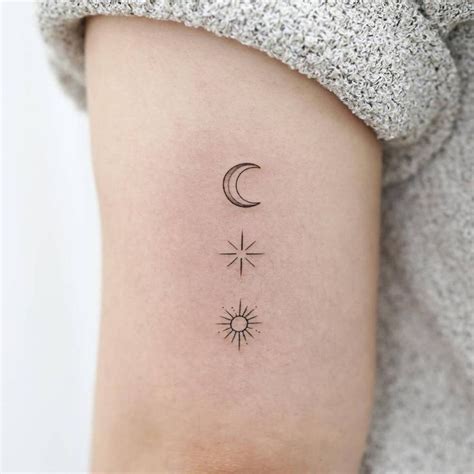 Sun, moon and star tattoo located on the tricep, | Sun tattoos, Star tattoos, Moon star tattoo