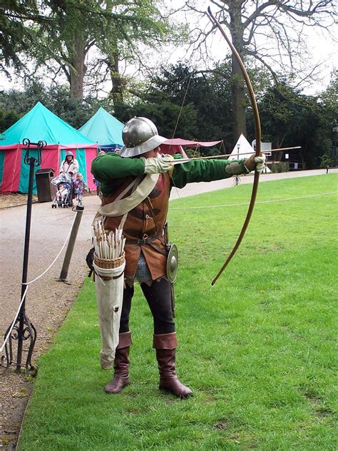 English archer firing arrows from an actual yew wood longbow at Warwick - a photo on Flickriver