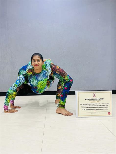 Longest time to hold two yoga poses (wheel pose, bow pose) - World Records Union™