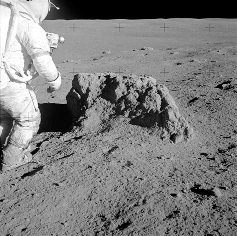 Apollo 14: Alan Shepard checks out a boulder | The Planetary Society