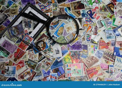 Stamp Collection with Magnifying Glass, Tweezers and Perforation Gauge Editorial Stock Image ...