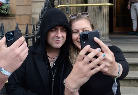 Fans swarm Green Day as rockers leave swanky Glasgow hotel after Bellahouston gig | The Scottish Sun