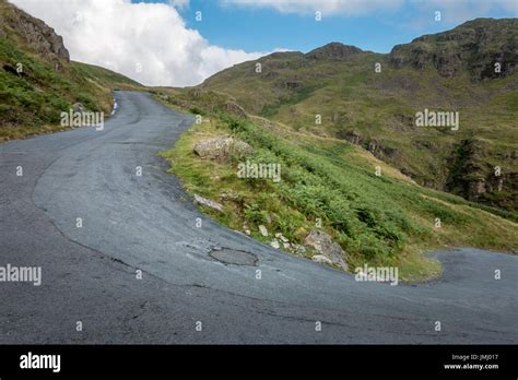 Hardknott pass, a steep and scenic countryside road with 30% gradient hairpin bends, English ...