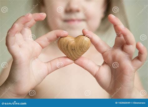 Tiny Baby Hands To Hold the Wooden Heart Stock Image - Image of fingers, feet: 102860049