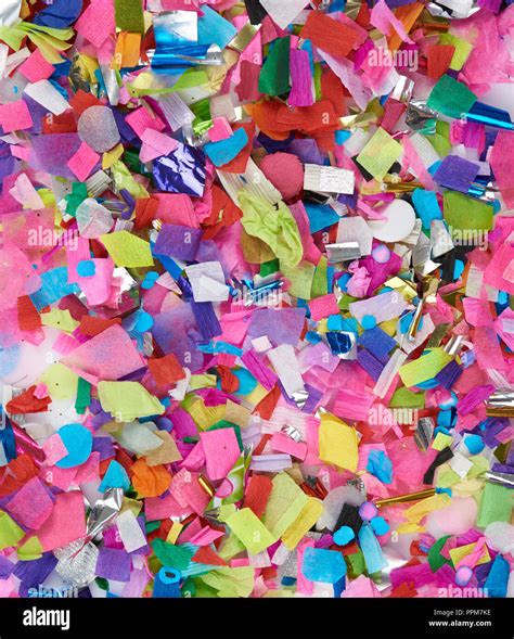 Shredded colorful paper confetti background. Different color small paper pieces Stock Photo - Alamy