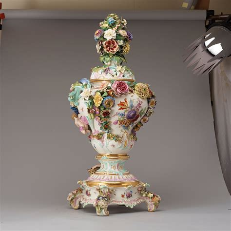 A large Meissen porcelain flower-encrusted pot-pourri vase, cover and ...