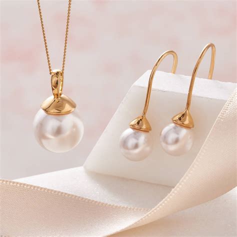 pearl necklace and earring set in gold by claudette worters | notonthehighstreet.com