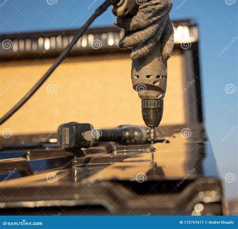 Installation of Metal Tiles on the Roof of the House Stock Image - Image of worker, metal: 172751517