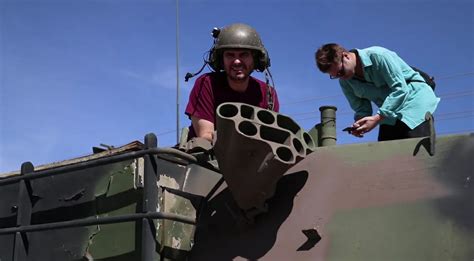 Presidential candidate Michael Dukakis on a tank. (1988) : r ...