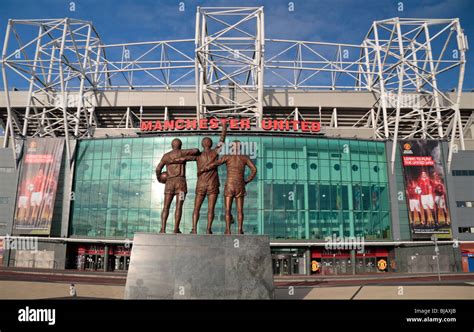 The statue to Sir Bobby Charlton, George Best Denis Law at the main entrance (East stand) to Old ...