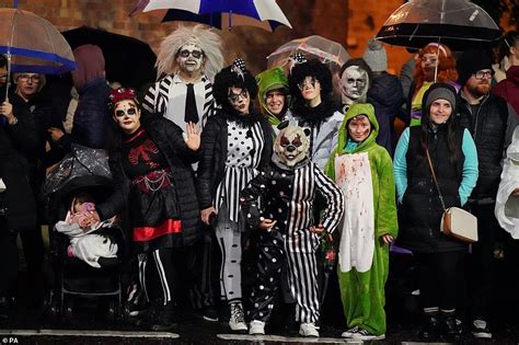 It's the witching hour! Thousands of revellers celebrate Halloween in Derry as parade returns ...