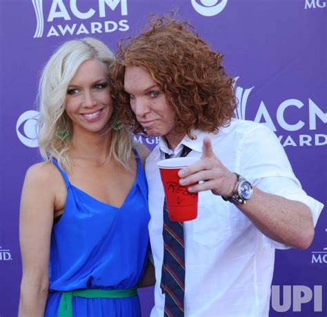 Photo: Comedian Carrot Top (R) and Amanda Hogan arrive at the Academy of Country Music Awards in ...