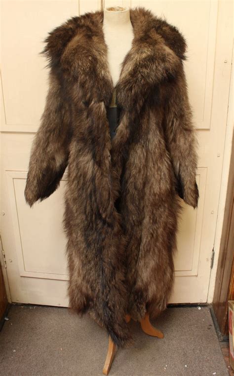 A large full-length Timber Wolf fur coat, together with another fur coat both by Thorpe and Crump