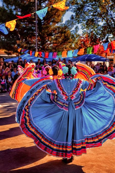 a group of people that are standing around with some kind of colorful ...