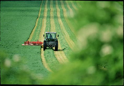 Tractor Cutting Grass Photograph by Jeremy Walker - Fine Art America