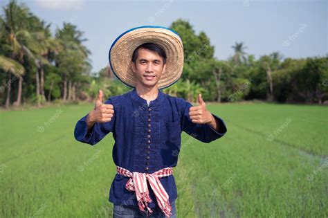 Premium Photo | Asian farmer man wear traditional costume standing and ...