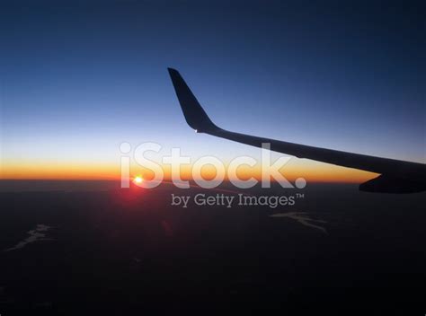 Airplane Wing With Sunset In The Background Stock Photo | Royalty-Free ...