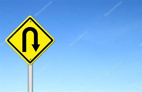 Yellow warning sign u-turn roadsign with blue sky background Stock ...