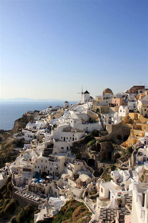 HD wallpaper: Santorini Island, Greece, white buildings on rock formation with sea in distant ...