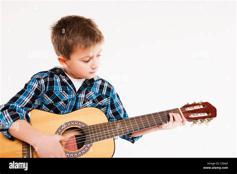 Boy playing guitar Stock Photo - Alamy