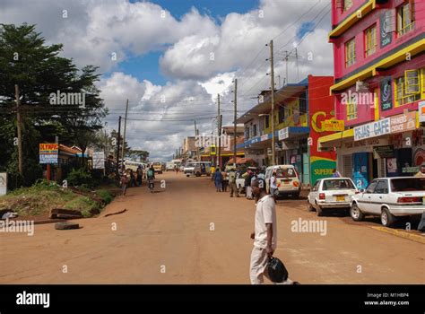 Thika Kenya November 7 2008. Typical street scene in Thika , Kenya.Cars and unidentified people ...