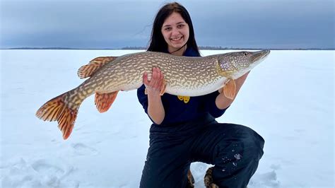 Ice Fishing Giant Northern Pike With My Sister "Lake Winnipeg North Basin" - YouTube