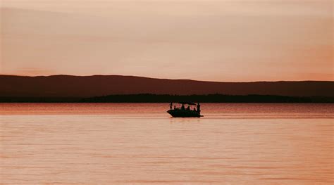 People Riding on Boat During Sunset · Free Stock Photo