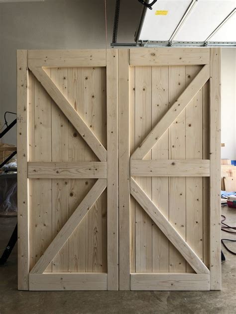DIY Barn Yard Doors | Diy garage door, Making barn doors, Garage door design