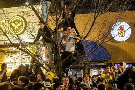 Michigan's Jim Harbaugh has father Jack perform 'Who's got it better' chant