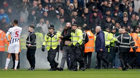 West Brom v Wolves suspended due to crowd trouble; players removed children from stands