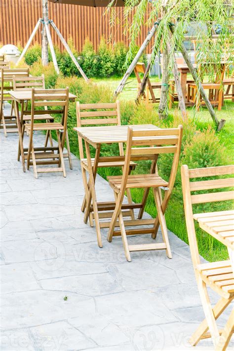 wood table and chair in outdoor coffee shop cafe and restaurant ...